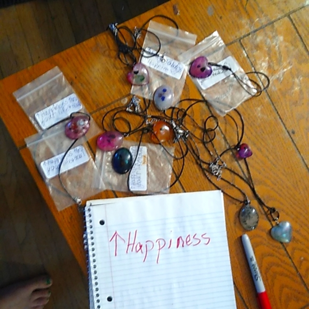 Necklaces and pendants with Chakra crystals inside for happiness.